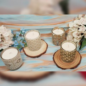 Decorative Votive Jars (Single piece each). Beautifully curated scented votive candles . Available in Apple CInnamon and Misty Lavendar.